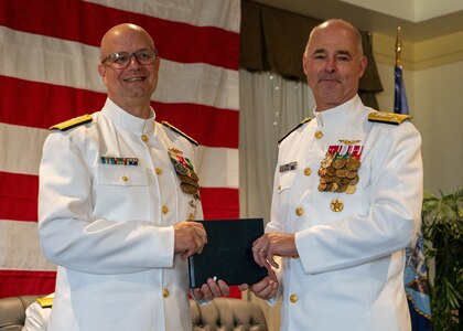 NAVAL STATION NORFOLK (Sept. 12, 2025) – Rear Adm. Carl Lahti poses for a photo with Commander, Navy Installations Command, Vice Adm. Scott Gray, during a change of command and retirement ceremony held at Vista Point onboard Naval Station Norfolk, Sept. 12. CNRMA, now commanded by Rear Adm. Stephen Barnett, is the regional coordinator for all shore-based naval personnel and shore activities in the Mid-Atlantic region, which encompasses 20 states, 13 installations, and numerous Navy reserve centers from Maine to Virginia and as far west as Illinois. (U.S. Navy photo by Mass Communication Specialist 1st Class Kirk T. Putnam)