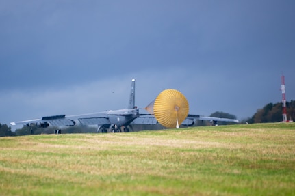 A B-52 Stratofortress lands with its drag chute depoloyed.