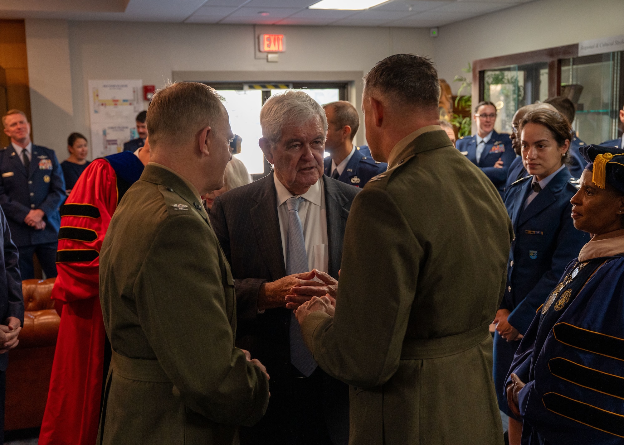 Newt Gingrich, Former Speaker of the House, interacts with guests attending his honorary doctorate ceremony at Maxwell Air Force Base, Alabama