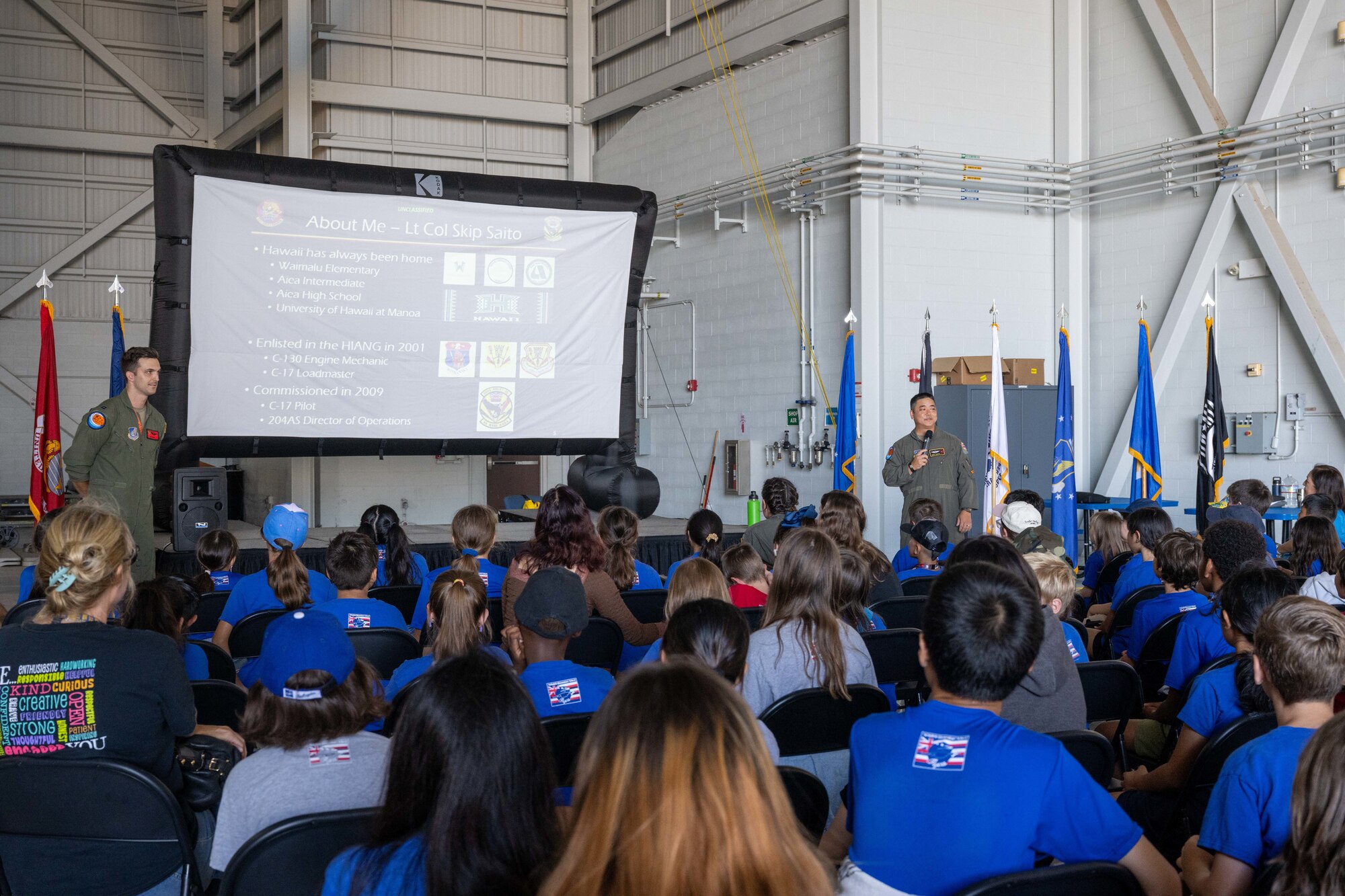 Students from across Oahu listen to a brief by U.S. Air Force pilots on the C-17 Globemaster III.