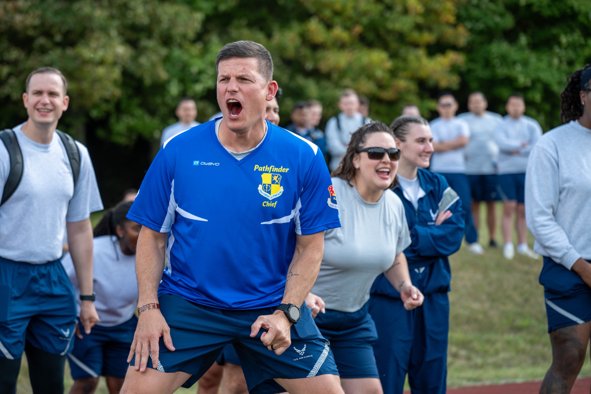 CMSgt Nicholas Whitney cheers for teammates during a tug-of-war match on Pathfinder Day
