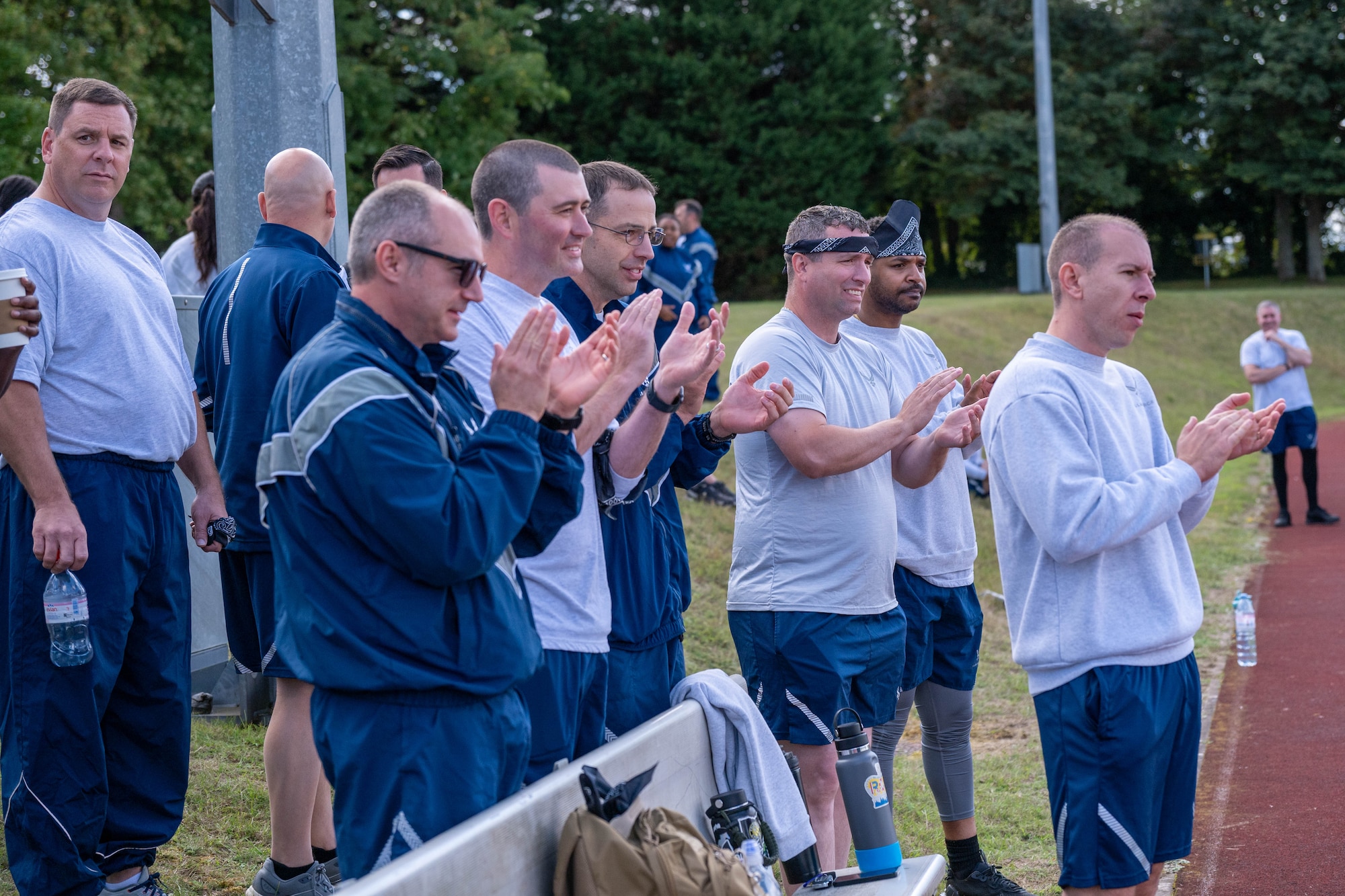 Airmen cheer on teammates during a combat fitness challenge