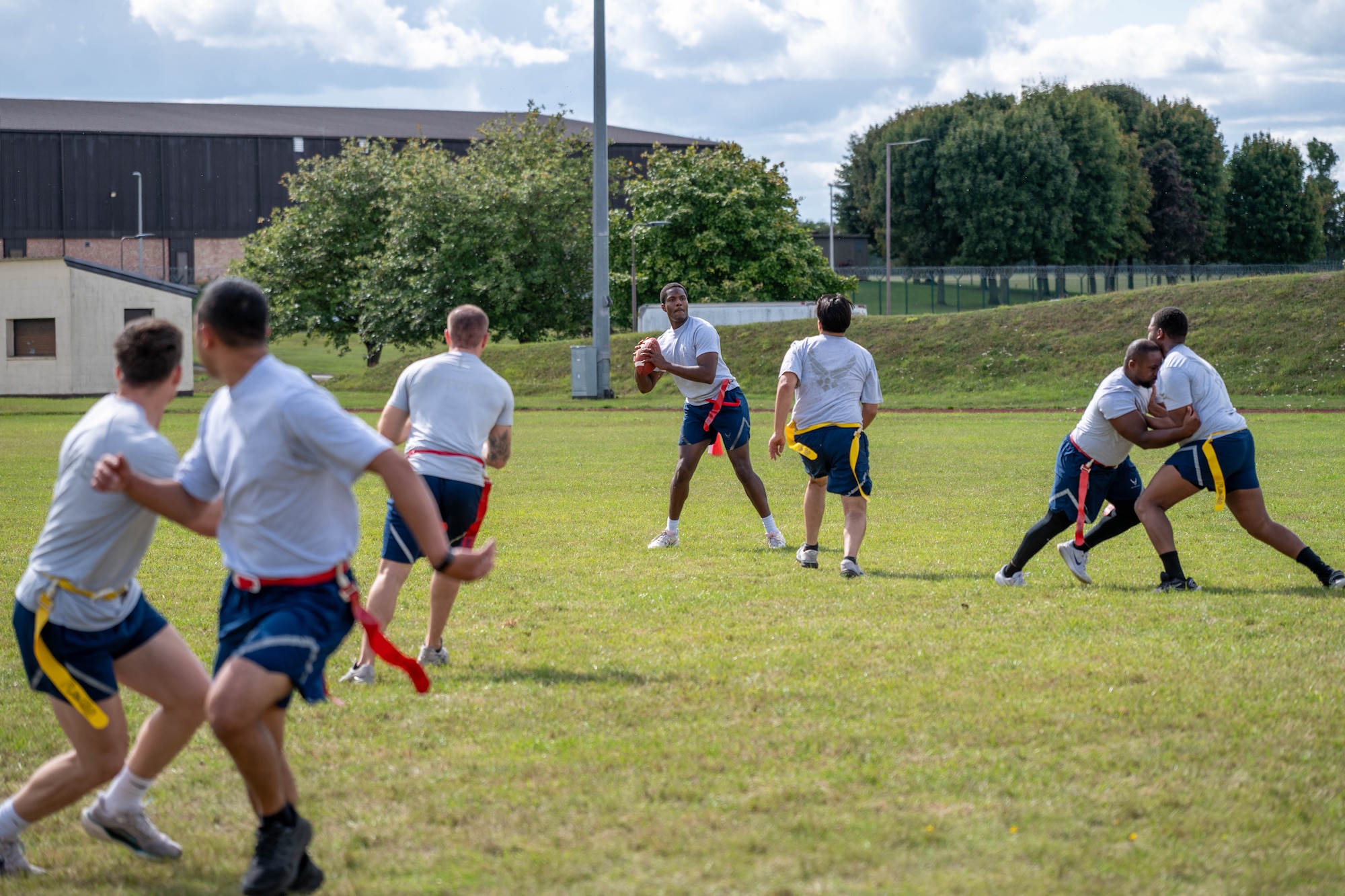 An Airman prepares to throw the football during a flag football game