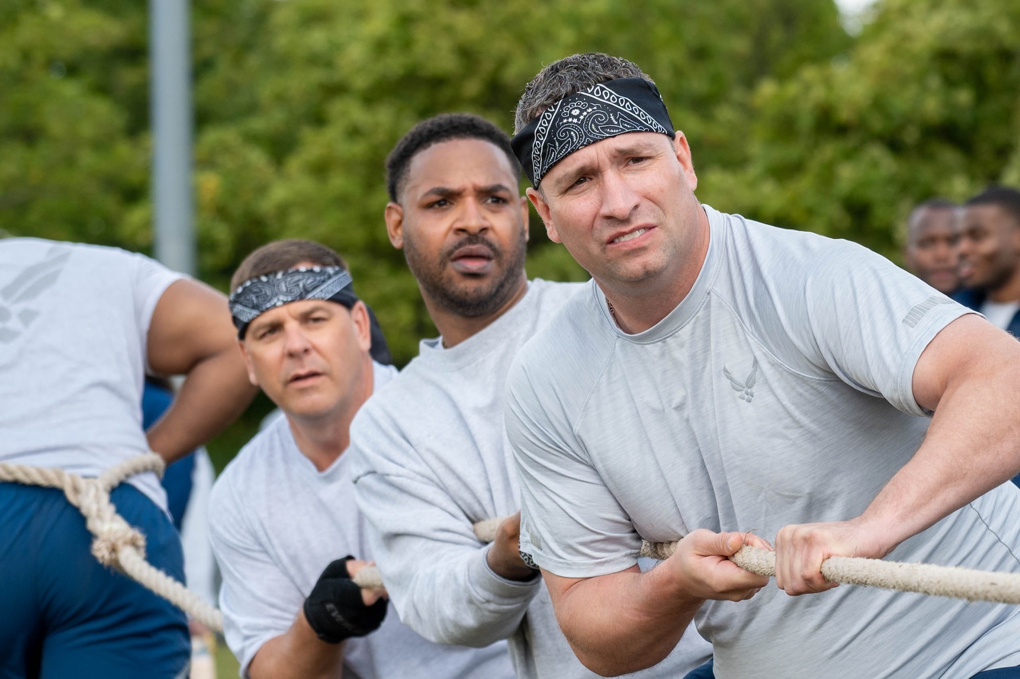 Airmen prepare to pull during a tug-of-war competition