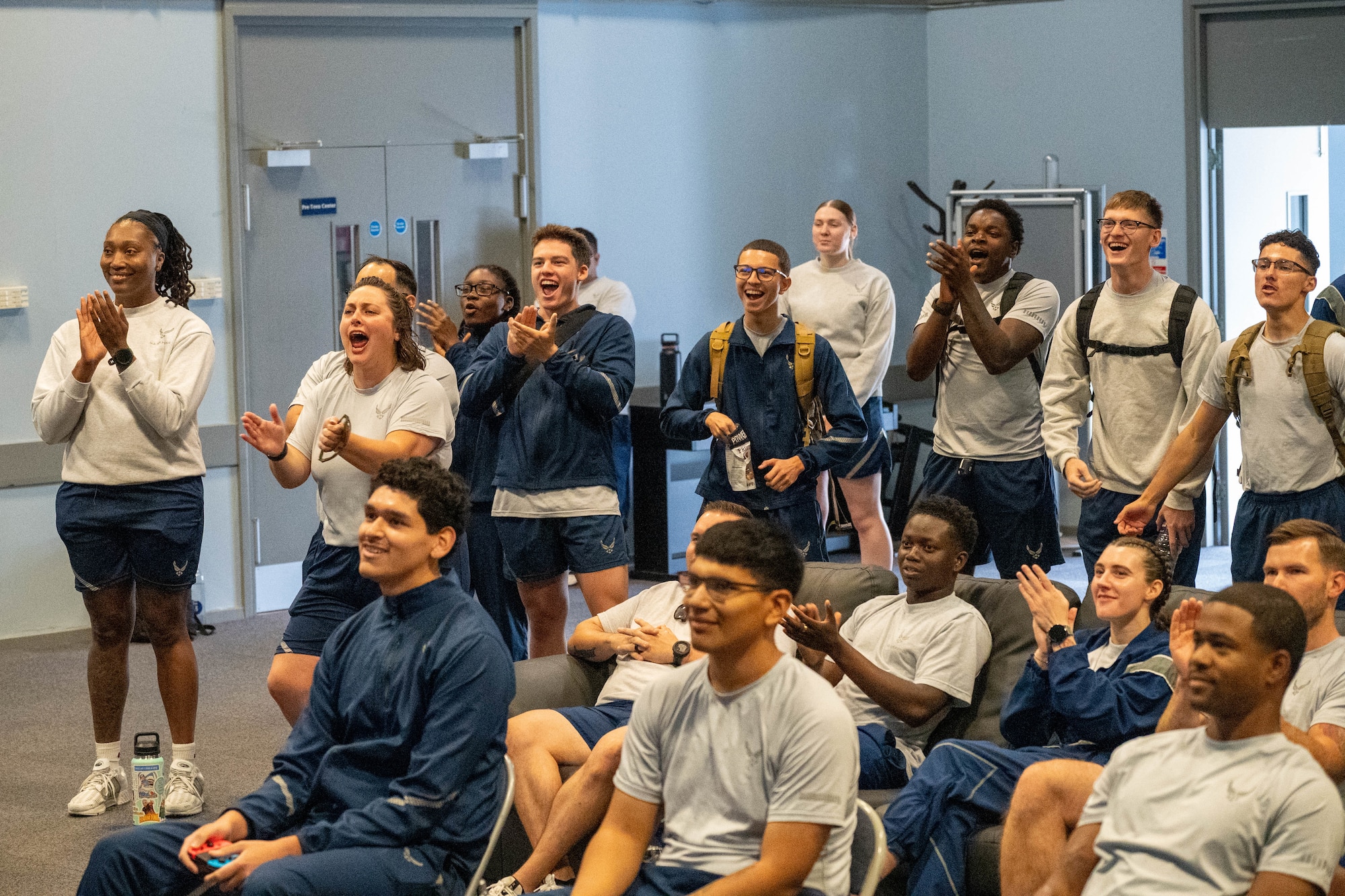 Airmen cheer during a Mario Kart tournament