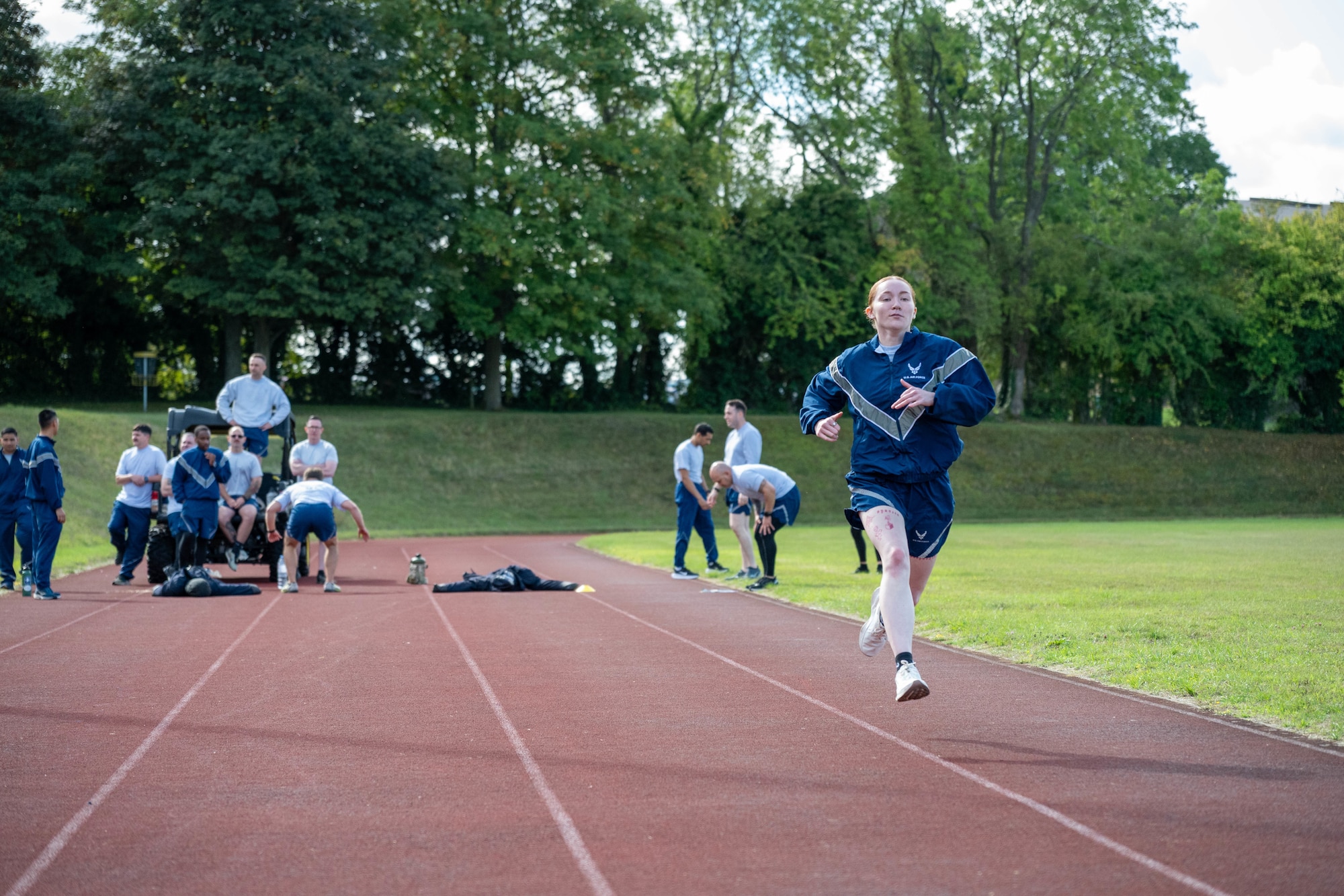 An Airman sprints on the track