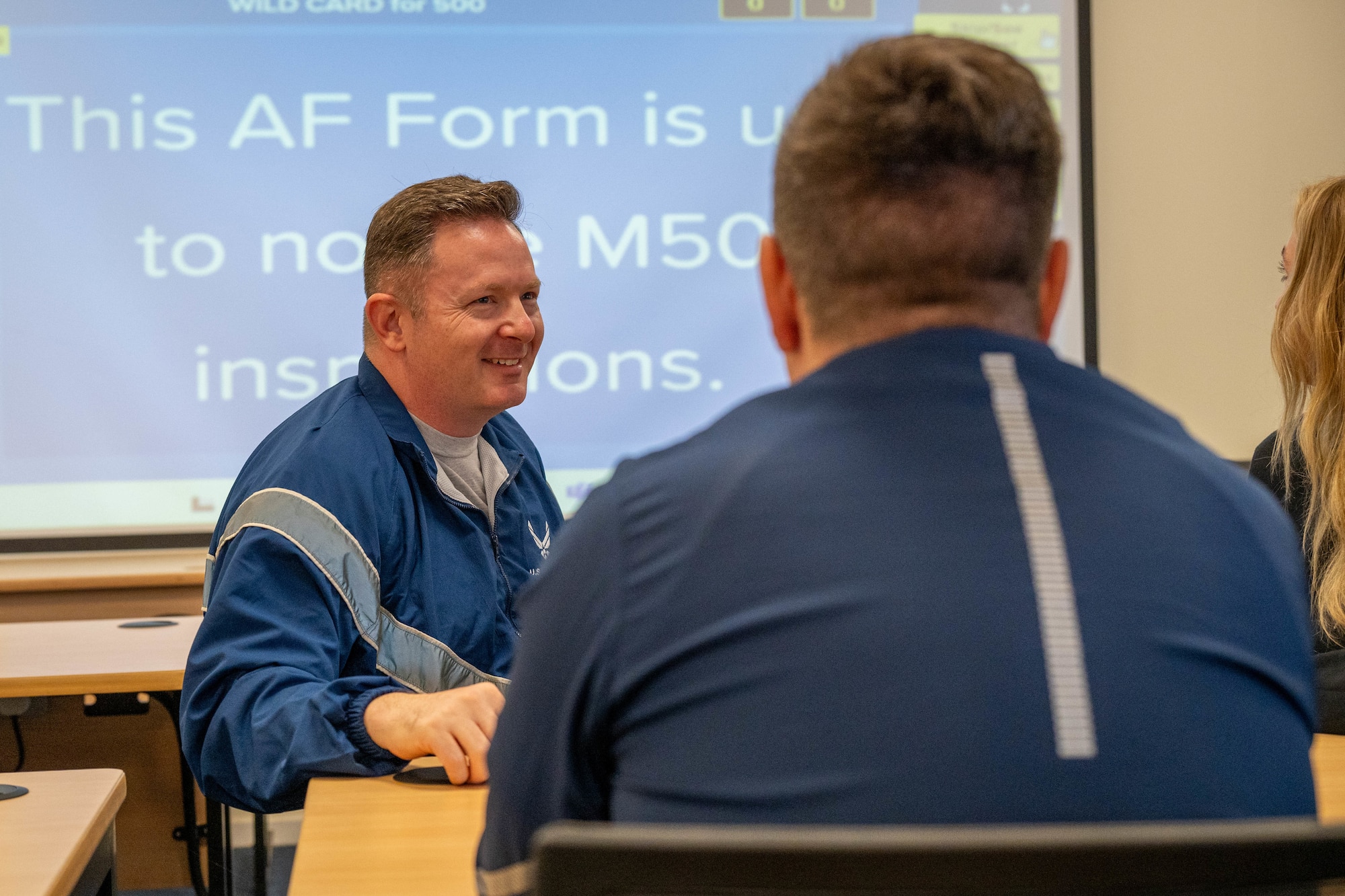 An Airman smiles during a trivia competition on Pathfinder Day