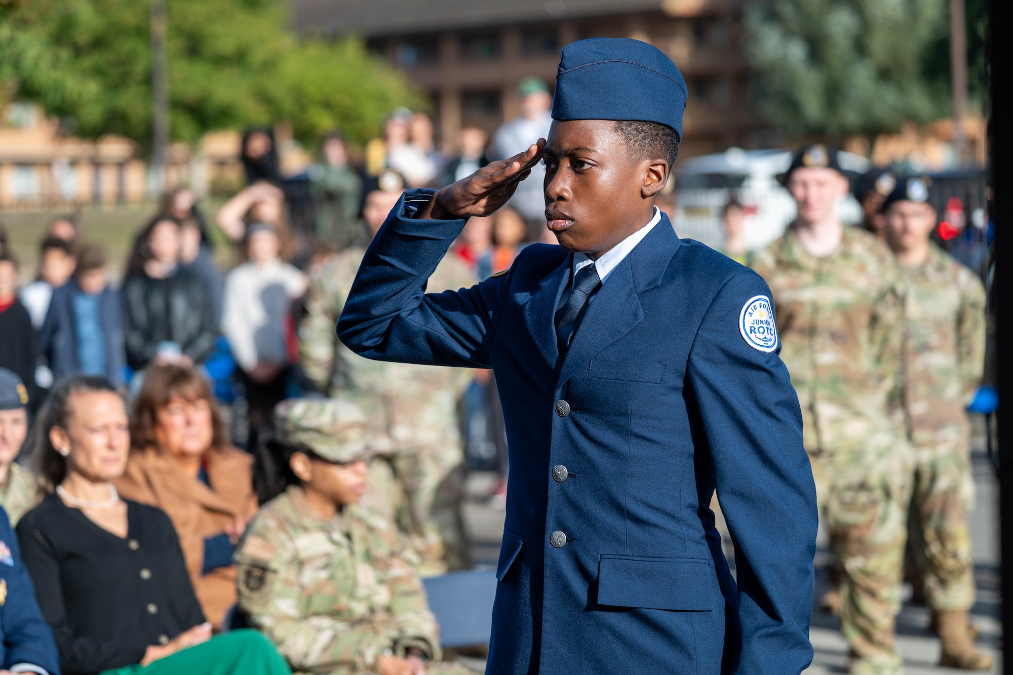 A Junior ROTC cadet salutes during a 9/11 memorial ceremony