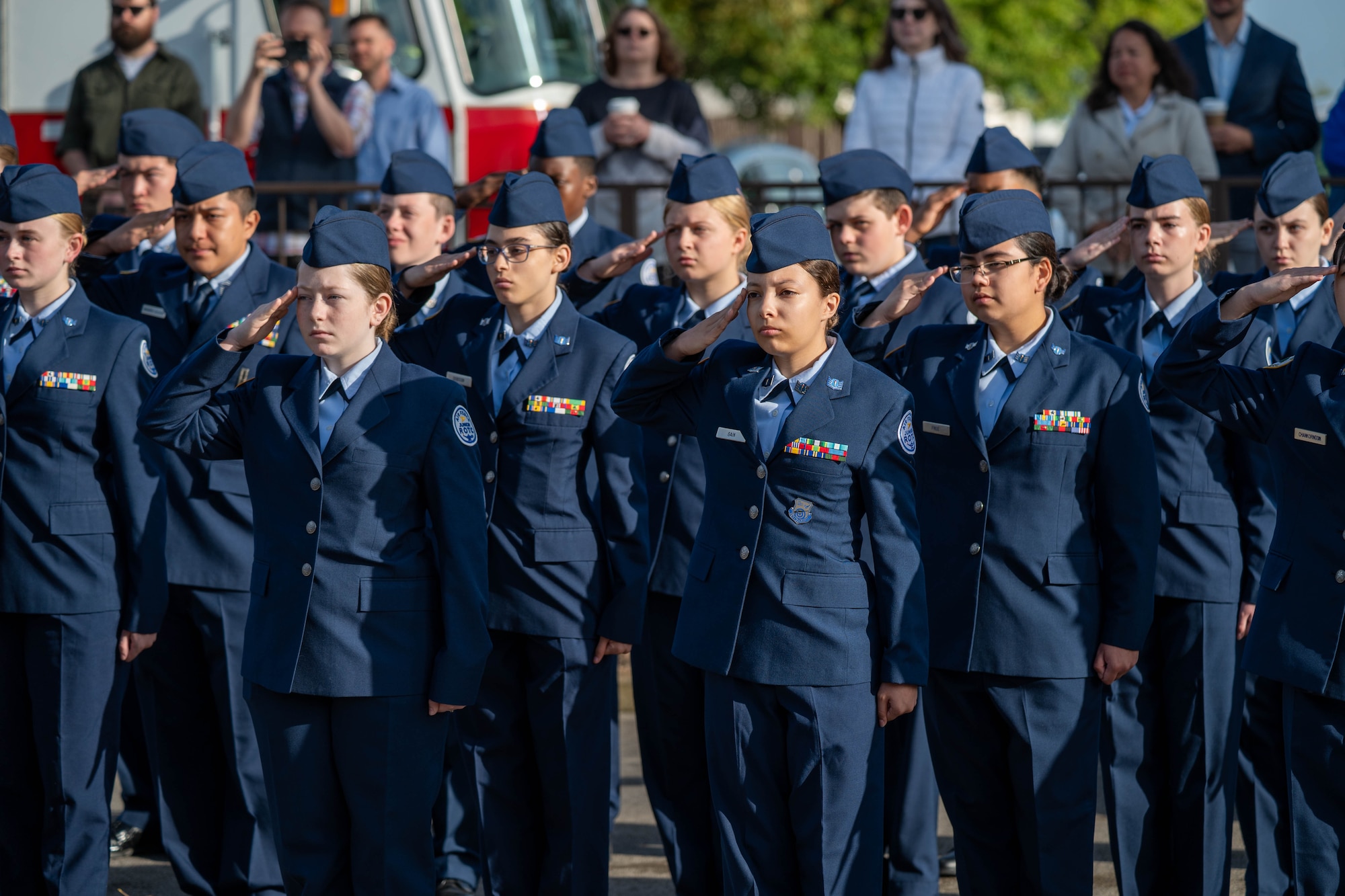 Junior ROTC cadets salute during a 9/11 memorial ceremony