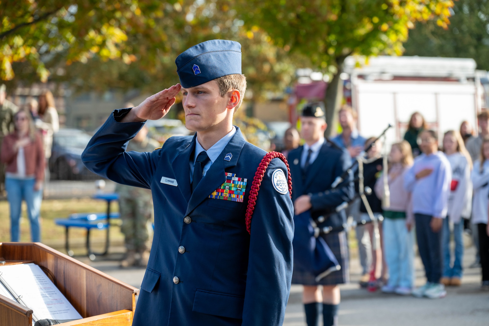 A Junior ROTC cadet renders a salute during a 9/11 memorial ceremony