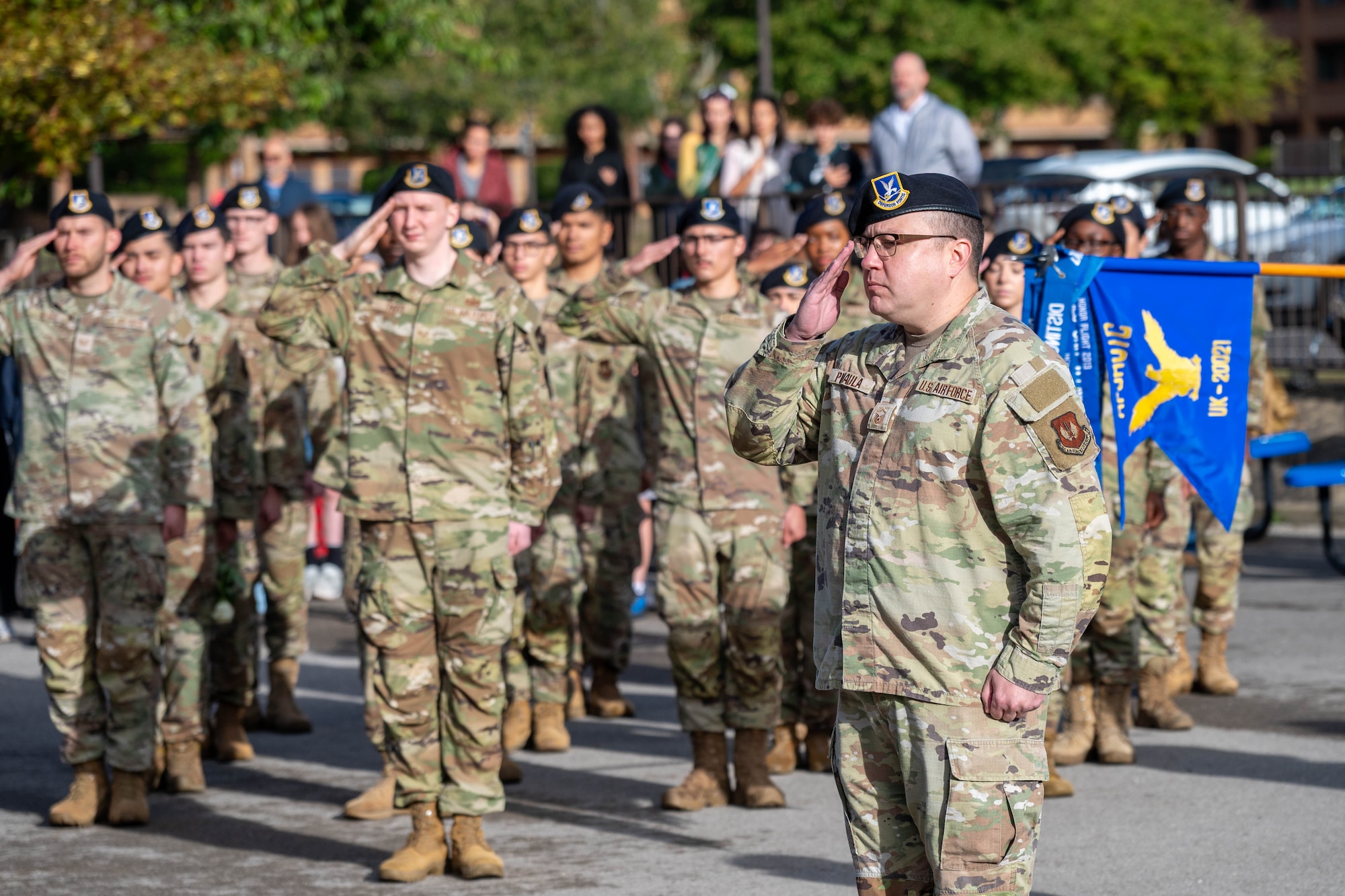 Defenders salute during a 9/11 memorial ceremony