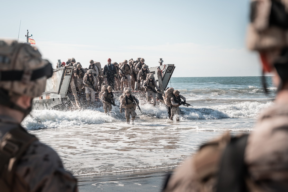 Marines with Infantería de Marina (Spanish marine corps) debark from amphibious ships at Onslow Beach as part of exercise UNITAS 2025, Marine Corps Base Camp Lejeune, North Carolina, Sep. 12, 2025. UNITAS, which is Latin for “unity,” was conceived in 1959 and has taken place annually since first conducted in 1960. This marks the 66th iteration of the world’s longest running annual multinational maritime exercise. (U.S. Marine Corps photo by Cpl. Osmar VasquezHernandez)
