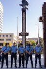 Firefighters from the Indianapolis Fire Department’s Station 13 join in prayer in front of a beam from the World Trade Center during a commemoration ceremony at the Indiana 9/11 Memorial in Indianapolis Sept. 11, 2025. Soldiers and civilians from the U.S. Army Financial Management Command joined the Daughters of the American Revolution Caroline Scott Harrison Chapter, IFD, police officers from various agencies and members of the public to commemorate the 24th anniversary of the terrorist attacks on Sept. 11, 2001. (U.S. Army photo by Mark R. W. Orders-Woempner)