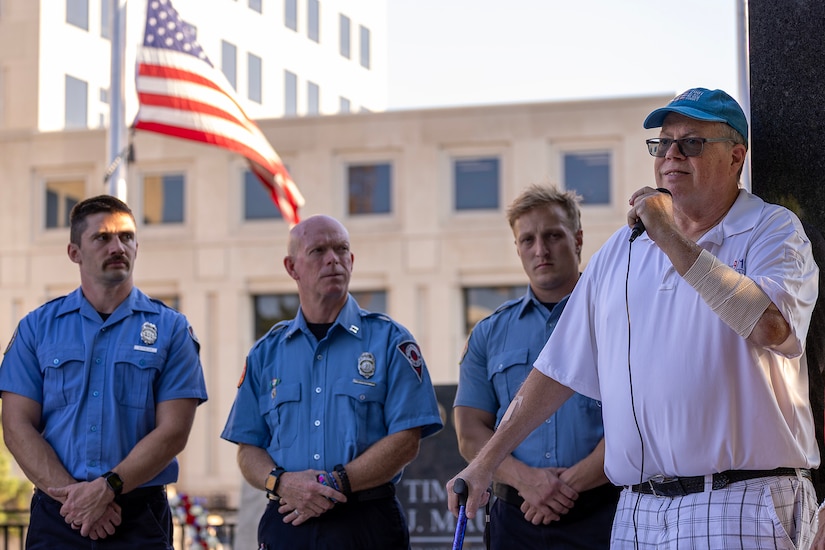 Greg Hess, retired Indianapolis Fire Department firefighter and paramedic, delivers remarks about his time at Ground Zero, his subsequent cancer struggles resulting from his time there, and his 22-month effort to establish the Indiana 9/11 Memorial as IFD firefighters from Station 13 listen during a commemoration ceremony at the memorial in Indianapolis Sept. 11, 2025. In 2001, Hess was a member of Indiana Task Force 1, which spent eight days in New York assisting the local agencies in the rescue and recovery efforts. (U.S. Army photo by Mark R. W. Orders-Woempner)
