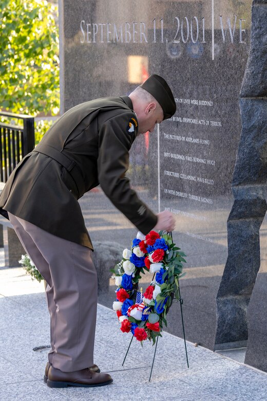 U.S. Army Col. Shaun D. McMurchie, 45th Finance Center director, lays a wreath during a commemoration ceremony at the Indiana 9/11 Memorial in Indianapolis Sept. 11, 2025. Soldiers and civilians from the U.S. Army Financial Management Command joined the Daughters of the American Revolution Caroline Scott Harrison Chapter, the Indianapolis Fire Department’s Station 13, police officers from various agencies and members of the public to commemorate the 24th anniversary of the terrorist attacks on Sept. 11, 2001. (U.S. Army photo by Mark R. W. Orders-Woempner)