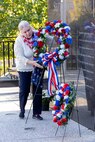 Janet Shelton, Daughters of the American Revolution Caroline Scott Harrison Chapter historian, lays a wreath during a commemoration ceremony at the Indiana 9/11 Memorial in Indianapolis Sept. 11, 2025. Soldiers and civilians from the U.S. Army Financial Management Command joined the DAR, the Indianapolis Fire Department’s Station 13, police officers from various agencies and members of the public to commemorate the 24th anniversary of the terrorist attacks on Sept. 11, 2001. (U.S. Army photo by Mark R. W. Orders-Woempner)