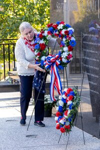 Janet Shelton, Daughters of the American Revolution Caroline Scott Harrison Chapter historian, lays a wreath during a commemoration ceremony at the Indiana 9/11 Memorial in Indianapolis Sept. 11, 2025. Soldiers and civilians from the U.S. Army Financial Management Command joined the DAR, the Indianapolis Fire Department’s Station 13, police officers from various agencies and members of the public to commemorate the 24th anniversary of the terrorist attacks on Sept. 11, 2001. (U.S. Army photo by Mark R. W. Orders-Woempner)