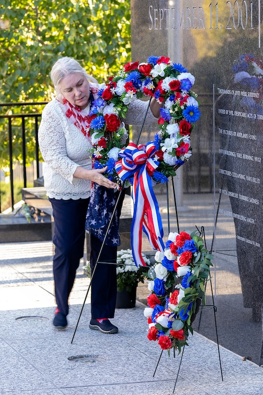 Janet Shelton, Daughters of the American Revolution Caroline Scott Harrison Chapter historian, lays a wreath during a commemoration ceremony at the Indiana 9/11 Memorial in Indianapolis Sept. 11, 2025. Soldiers and civilians from the U.S. Army Financial Management Command joined the DAR, the Indianapolis Fire Department’s Station 13, police officers from various agencies and members of the public to commemorate the 24th anniversary of the terrorist attacks on Sept. 11, 2001. (U.S. Army photo by Mark R. W. Orders-Woempner)