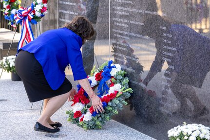 Vanessa Burkhart, Daughters of the American Revolution Caroline Scott Harrison Chapter, lays a wreath during a commemoration ceremony at the Indiana 9/11 Memorial in Indianapolis Sept. 11, 2025. Soldiers and civilians from the U.S. Army Financial Management Command joined the DAR, the Indianapolis Fire Department’s Station 13, police officers from various agencies and members of the public to commemorate the 24th anniversary of the terrorist attacks on Sept. 11, 2001. (U.S. Army photo by Mark R. W. Orders-Woempner)