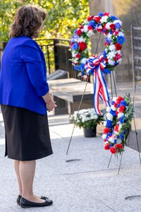 Vanessa Burkhart, Daughters of the American Revolution Caroline Scott Harrison Chapter, lays a wreath during a commemoration ceremony at the Indiana 9/11 Memorial in Indianapolis Sept. 11, 2025. Soldiers and civilians from the U.S. Army Financial Management Command joined the DAR, the Indianapolis Fire Department’s Station 13, police officers from various agencies and members of the public to commemorate the 24th anniversary of the terrorist attacks on Sept. 11, 2001. (U.S. Army photo by Mark R. W. Orders-Woempner)