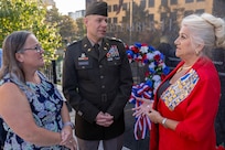 U.S. Army Col. Shaun D. McMurchie, 45th Finance Center director (center), and his wife, Amy McMurchie (left), talk with Jill Fewell, Daughters of the American Revolution Caroline Scott Harrison Chapter regent, during a commemoration ceremony at the Indiana 9/11 Memorial in Indianapolis Sept. 11, 2025. Soldiers and civilians from the U.S. Army Financial Management Command joined the DAR, the Indianapolis Fire Department’s Station 13, police officers from various agencies and members of the public to commemorate the 24th anniversary of the terrorist attacks on Sept. 11, 2001. (U.S. Army photo by Mark R. W. Orders-Woempner)