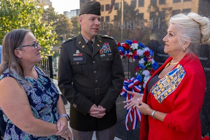 U.S. Army Col. Shaun D. McMurchie, 45th Finance Center director (center), and his wife, Amy McMurchie (left), talk with Jill Fewell, Daughters of the American Revolution Caroline Scott Harrison Chapter regent, during a commemoration ceremony at the Indiana 9/11 Memorial in Indianapolis Sept. 11, 2025. Soldiers and civilians from the U.S. Army Financial Management Command joined the DAR, the Indianapolis Fire Department’s Station 13, police officers from various agencies and members of the public to commemorate the 24th anniversary of the terrorist attacks on Sept. 11, 2001. (U.S. Army photo by Mark R. W. Orders-Woempner)