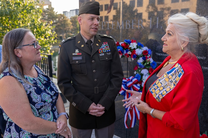 U.S. Army Col. Shaun D. McMurchie, 45th Finance Center director (center), and his wife, Amy McMurchie (left), talk with Jill Fewell, Daughters of the American Revolution Caroline Scott Harrison Chapter regent, during a commemoration ceremony at the Indiana 9/11 Memorial in Indianapolis Sept. 11, 2025. Soldiers and civilians from the U.S. Army Financial Management Command joined the DAR, the Indianapolis Fire Department’s Station 13, police officers from various agencies and members of the public to commemorate the 24th anniversary of the terrorist attacks on Sept. 11, 2001. (U.S. Army photo by Mark R. W. Orders-Woempner)