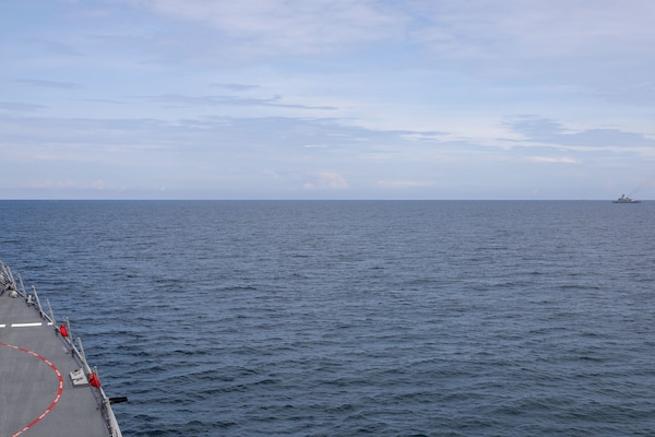 The Arleigh Burke-class guided-missile destroyer USS John Finn (DDG 113) takes station with the Jose Rizal-class frigate BRP Jose Rizal (FF-150) during Resolute Dragon 25 in the South China Sea, Sept. 12.
