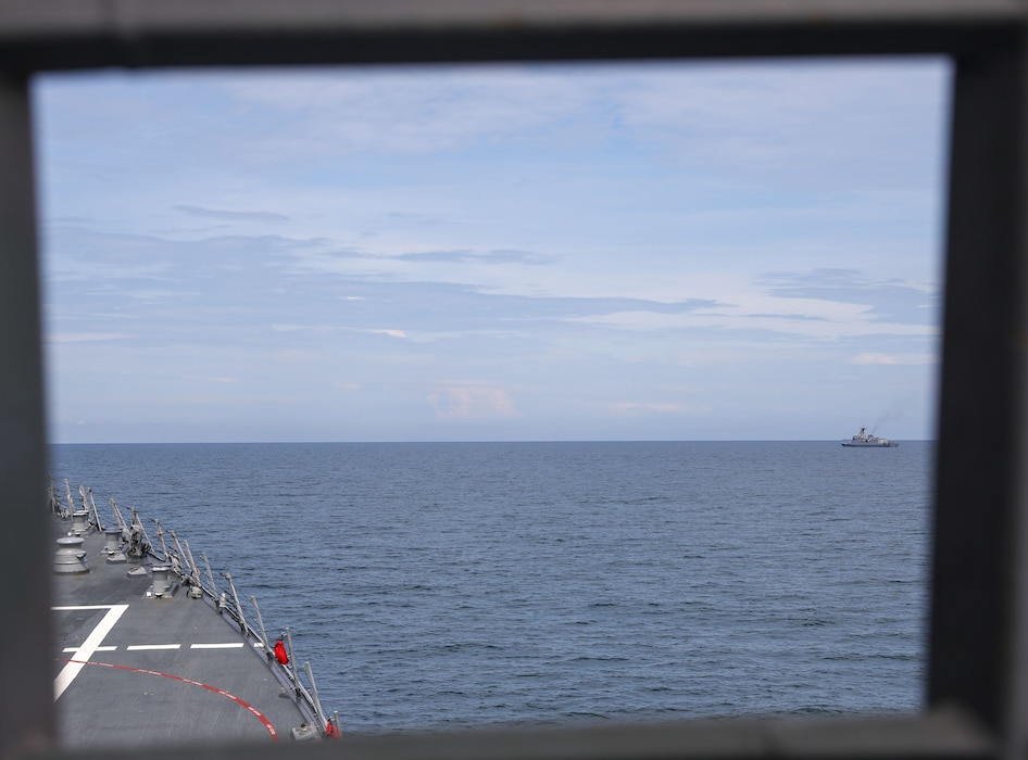 The Arleigh Burke-class guided-missile destroyer USS John Finn (DDG 113) takes station with the Jose Rizal-class frigate BRP Jose Rizal (FF-150) during Resolute Dragon 25 in the South China Sea, Sept. 12.