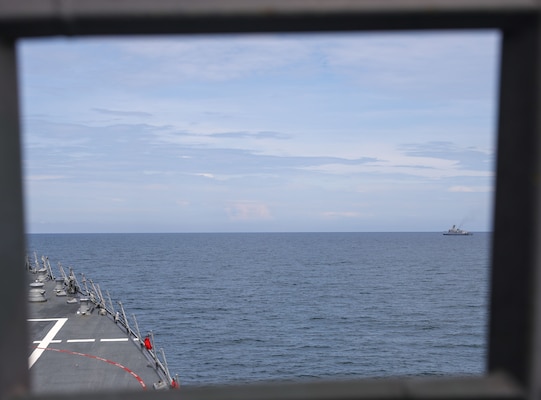 The Arleigh Burke-class guided-missile destroyer USS John Finn (DDG 113) takes station with the Jose Rizal-class frigate BRP Jose Rizal (FF-150) during Resolute Dragon 25 in the South China Sea, Sept. 12.