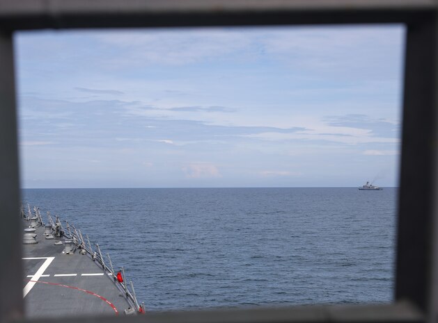 The Arleigh Burke-class guided-missile destroyer USS John Finn (DDG 113) takes station with the Jose Rizal-class frigate BRP Jose Rizal (FF-150) during Resolute Dragon 25 in the South China Sea, Sept. 12.
