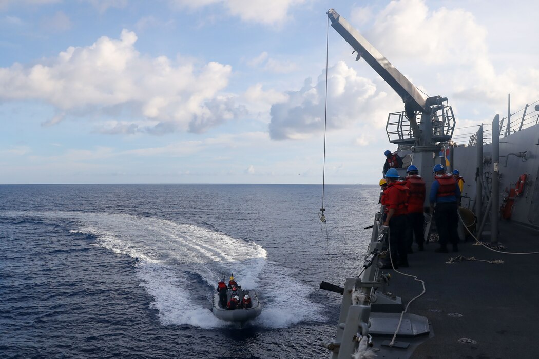 Sailors aboard the Arleigh Burke-class guided-missile destroyer USS John Finn (DDG 113) conduct a small boat operation during Maritime Cooperative Activity with the Osumi-class tank landing ship JS Osumi (LST-4001) and the Jose Rizal-class frigate BRP Jose Rizal (FF-150) in the South China Sea, Sept. 13.