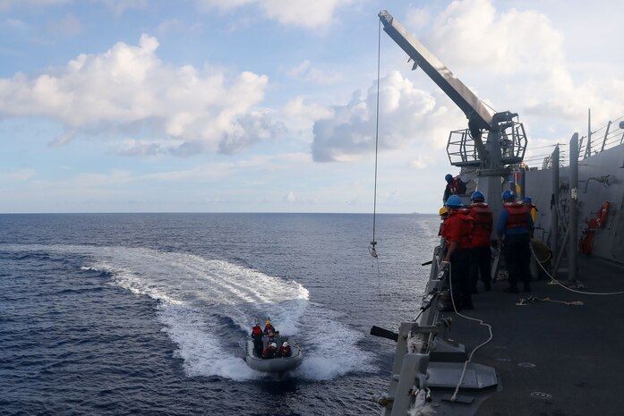 Sailors aboard the Arleigh Burke-class guided-missile destroyer USS John Finn (DDG 113) conduct a small boat operation during Maritime Cooperative Activity with the Osumi-class tank landing ship JS Osumi (LST-4001) and the Jose Rizal-class frigate BRP Jose Rizal (FF-150) in the South China Sea, Sept. 13.