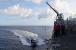 Sailors aboard the Arleigh Burke-class guided-missile destroyer USS John Finn (DDG 113) conduct a small boat operation during Maritime Cooperative Activity with the Osumi-class tank landing ship JS Osumi (LST-4001) and the Jose Rizal-class frigate BRP Jose Rizal (FF-150) in the South China Sea, Sept. 13.