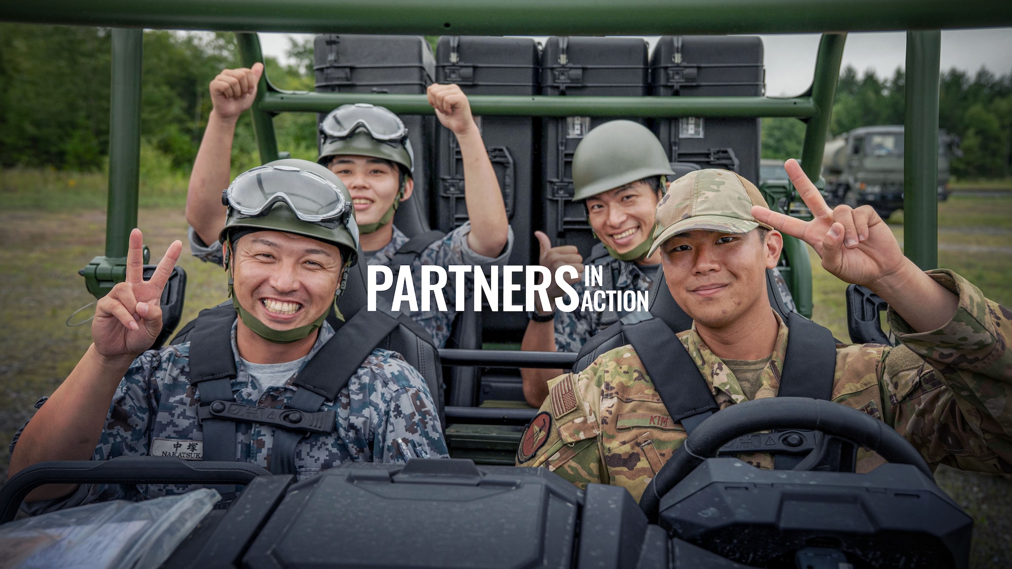 U.S. Air Force 2nd Lt. Nicholas Srajer, left, 35th Civil Engineer Squadron Design officer in charge, shovels debris alongside a Japan Air Self Defense Force airman assigned to the 2nd Air Wing during exercise Resolute Force Pacific 2025 while conducting Rapid Airfield Damage Repair (RADR) training at Chitose Air Base, Japan, July 29, 2025.