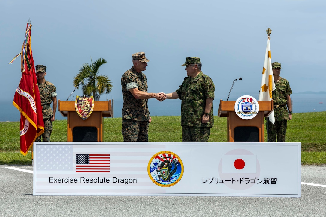 U.S. Marine Corps Lt. Gen. Roger Turner, commanding general of III Marine Expeditionary Force and Lt. Gen. Seiji Toriumi, commanding general of Western Army, shake hands to commemorate the opening ceremony of Resolute Dragon 25, Camp Courtney, Okinawa, Japan, Sept. 11, 2025.