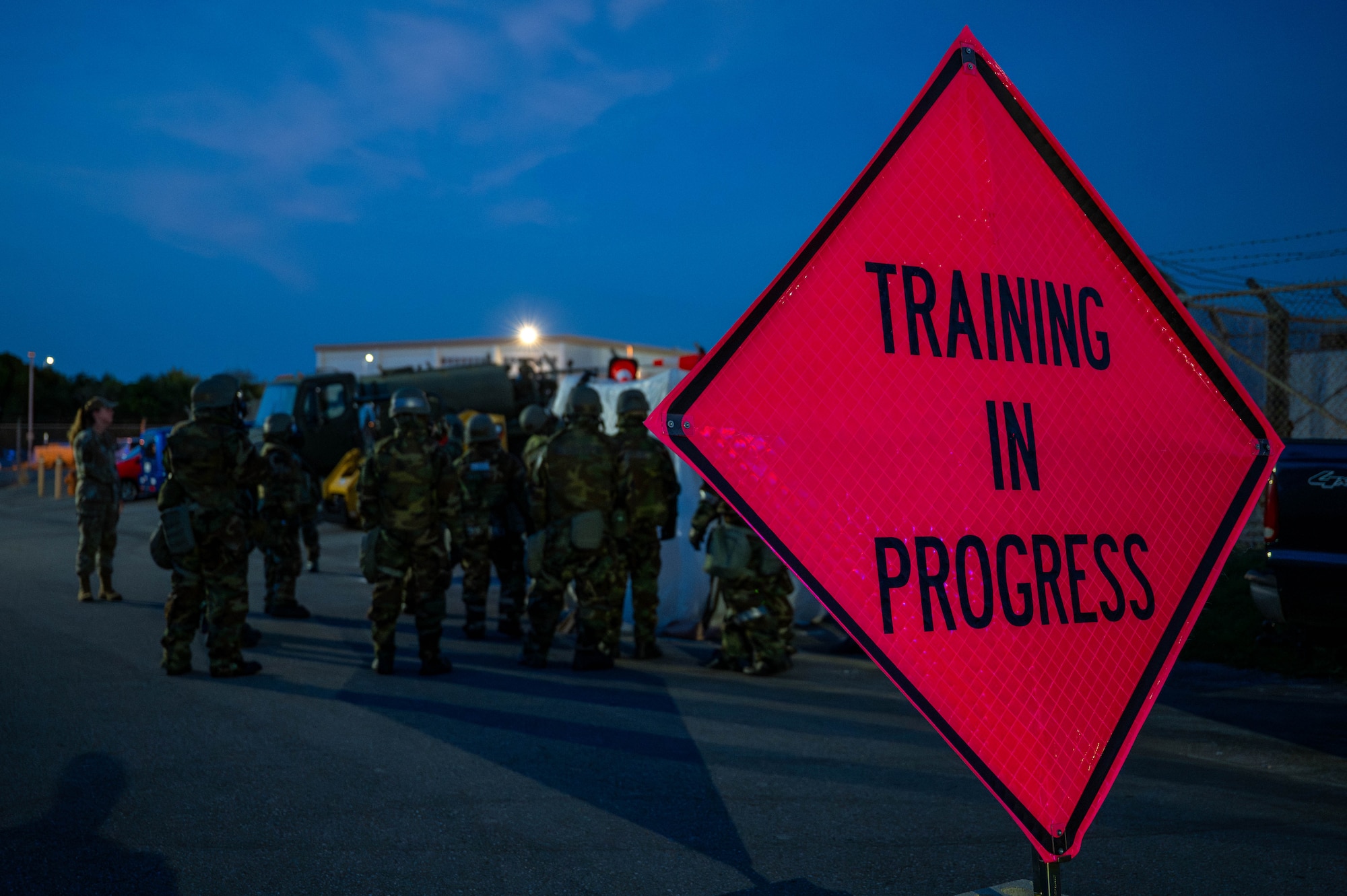 U.S. Air Force Airmen assigned to the 18th Wing, participate in a training exercise during a chemical, biological, radiological and nuclear defense course at Kadena Air Base, Japan, Sept. 4, 2025. The training prepares service members to stay calm, communicate, and execute trained fundamentals during a contamination emergency. (U.S. Air Force photo by Airman Nathaniel Jackson)