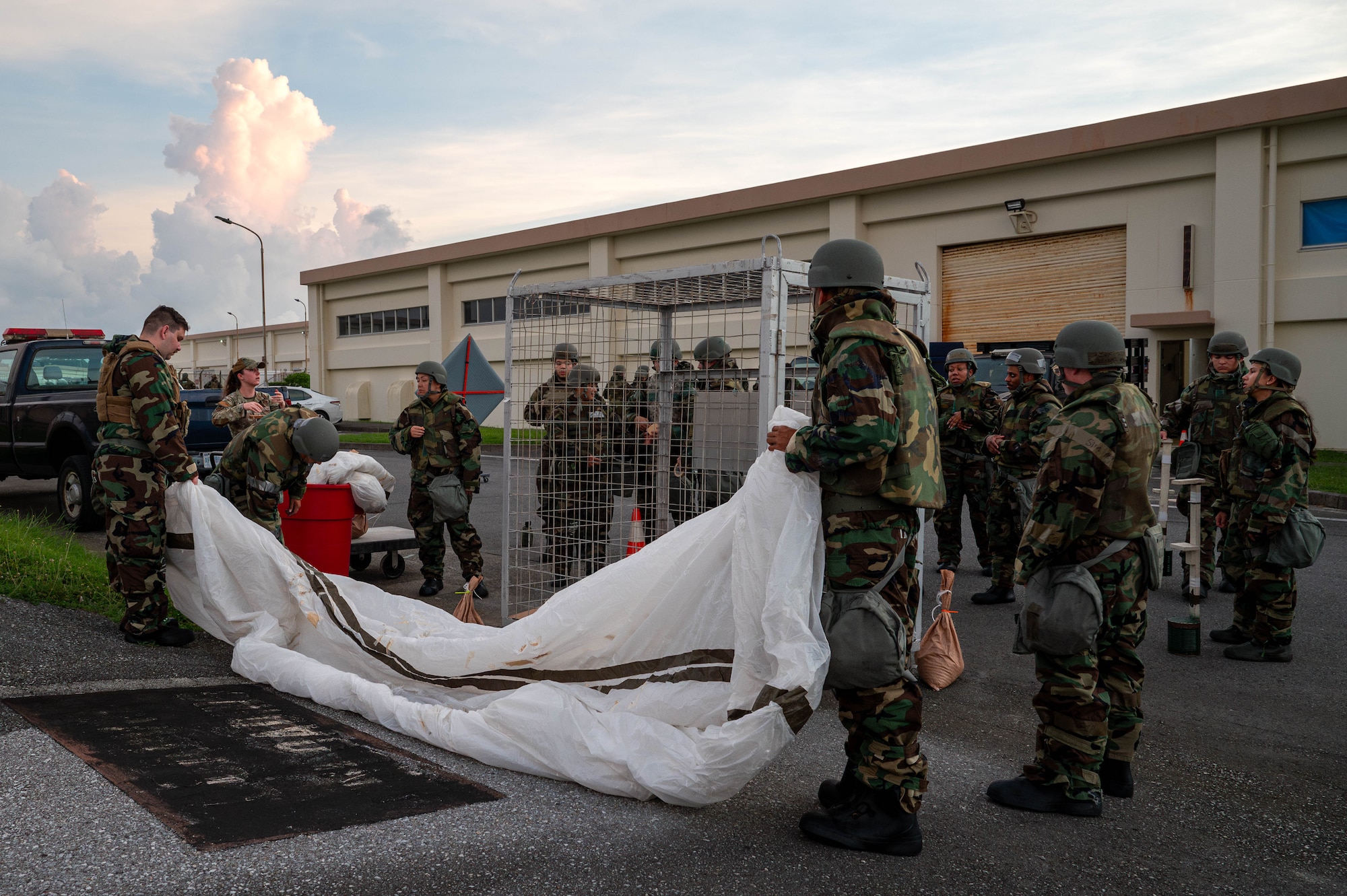 U.S. Air Force Airmen assigned to the 18th Wing, take part in a chemical, biological, radiological and nuclear defense training course at Kadena Air Base, Japan, Sept. 4, 2025. The training prepares service members to stay calm, communicate, and work through the difficulties of a contaminated battlefield. (U.S. Air Force photo by Airman Nathaniel Jackson)
