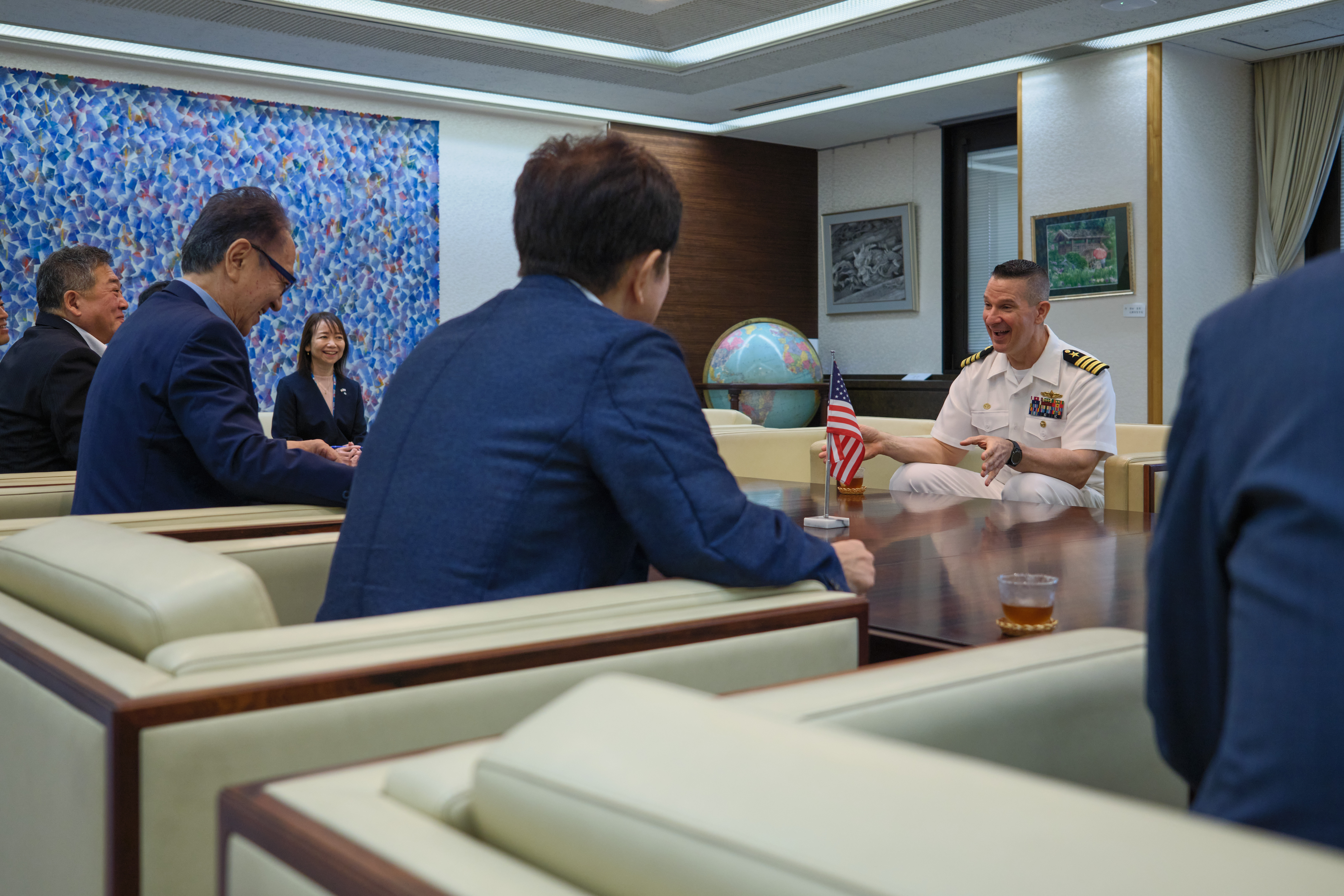 Capt. Les Sobol, Commander, Fleet Activities Yokosuka (CFAY), tells City of Yokosuka Mayor Katsuaki Kamiji what the friendship between CFAY and City of Yokosuka has meant to the base community during to an office call at Yokosuka City Hall Thursday, Sept. 11, 2025 in Yokosuka, Japan.