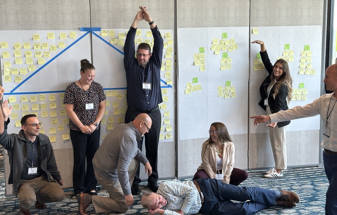 Group of people in various positions participating in an exercise