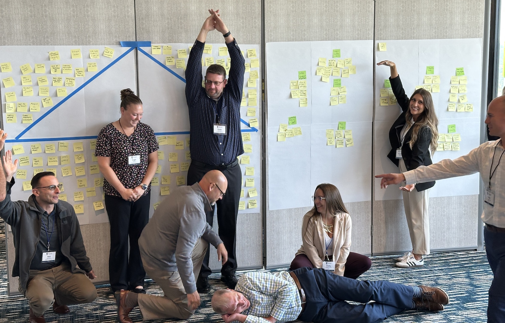 Group of people in various positions participating in an exercise