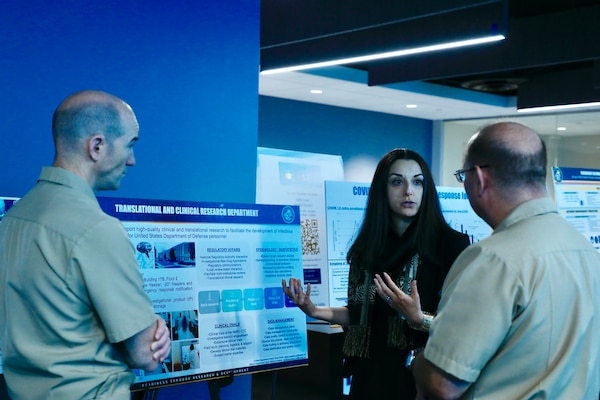 BETHESDA, Md. (Sept. 11, 2025) Sandra Isidean, with Naval Medical Research Command’s (NMRC) Clinical Trials Center, engages with attendees at a meeting of the Health Services Operational Advisory Group (HSOAG). Marine Corps Health Services, led by Rear Adm. Guido Valdes, The Medical Officer (TMO) of the Marine Corps, advises the Commandant and Marines Headquarters staff on all healthcare matters. TMO serves as the functional expert in working with the appropriate Headquarters agencies for determining medical requirements and makes recommendations on all medical matters relevant to supporting the Marine Corps. NMRC, headquarters of Navy Medicine Research & Development, is engaged in a broad spectrum of activity from basic science in the laboratory to field studies in austere and remote areas of the world to investigations in operational environments. In support of Navy, Marine Corps and joint U.S. warfighter health, readiness and lethality, researchers study infectious diseases, biological warfare detection and defense, combat casualty care, environmental health concerns, aerospace and undersea medicine, operational mission support and epidemiology. (U.S. Navy photo by Aleece Williams/Released)