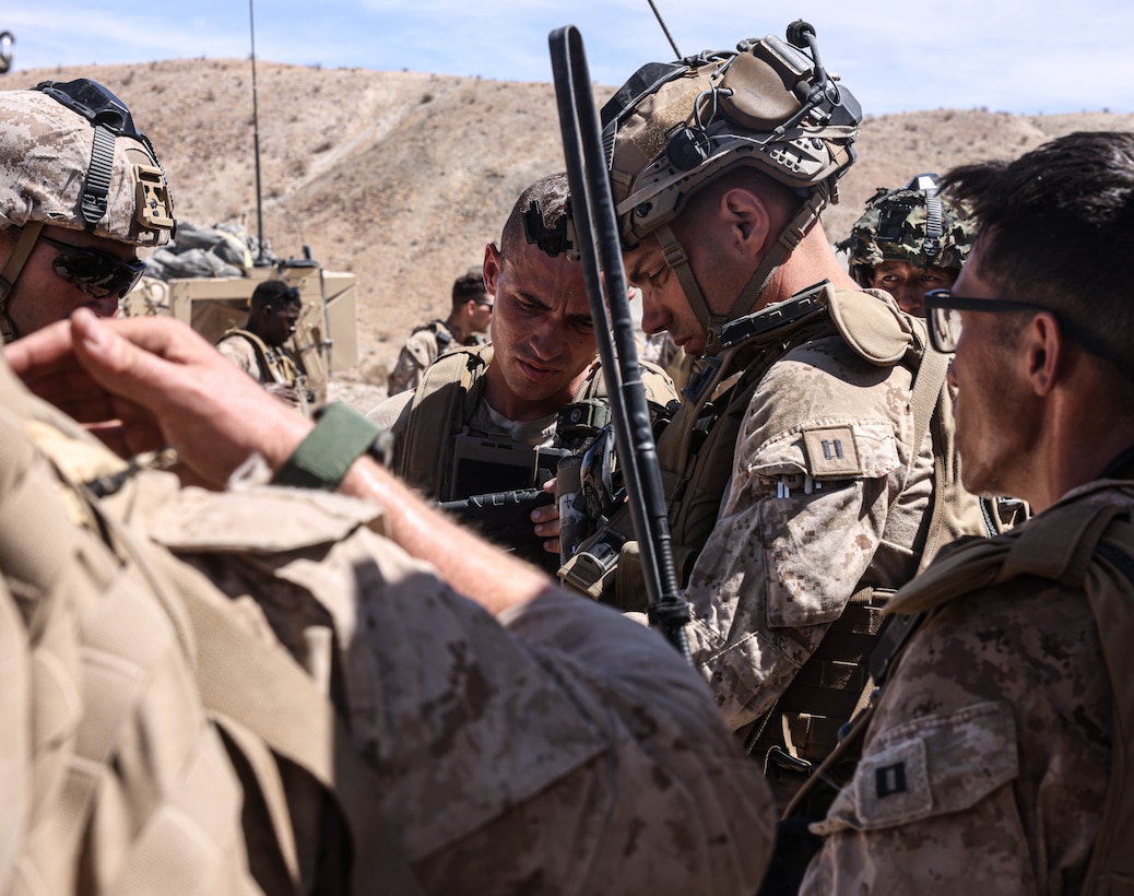 U.S. Marines with 2nd Air Naval Gunfire Liaison Company, II Marine Expeditionary Force Information Group and French Legionnaires with 2nd Foreign Infantry Regiment, 6th Light Armored Brigade, participate in Marine Air Ground Task Force Warfighting Exercise during Service Level Training Exercise 4-25, at Marine Corps Air-Ground Combat Center, Twentynine Palms, California, Aug. 19, 2025. SLTE 4-25 is designed to be a challenging, realistic training environment that produces combat-ready forces capable of operating as an integrated Marine Air Ground Task Force across all domains of military operations. (Courtesy Photo)