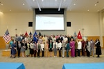 Participants of the Defense Logistics Agency Equal Employment Opportunity Symposium 2025 pose for a group photo at Troop Support in Philadelphia. DLA Chief of Staff Karyn Runstrom and DLA EEO Director Janice Samuel provided opening remarks at the event. Photo taken by: Ed Maldonado