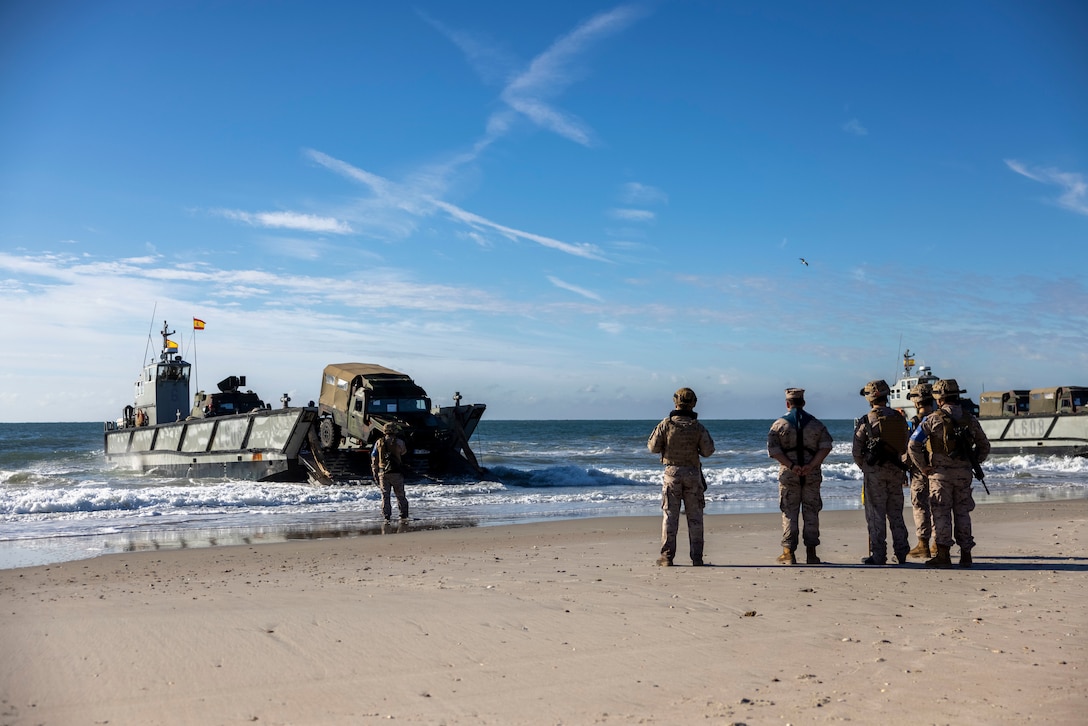 Marines with Infantería de Marina, (Spanish marine corps), disembark from a landing craft mechanized at Onslow Beach in preparation to execute exercise UNITAS 2025, Marine Corps Base Camp Lejeune, North Carolina, Sep. 12, 2025. UNITAS, which is Latin for “unity,” was conceived in 1959 and has taken place annually since first conducted in 1960. This year marks the 66th iteration of the world’s longest running annual multinational maritime exercise. (U.S. Marine Corps photo by Lance Cpl. Payton Goodrich)