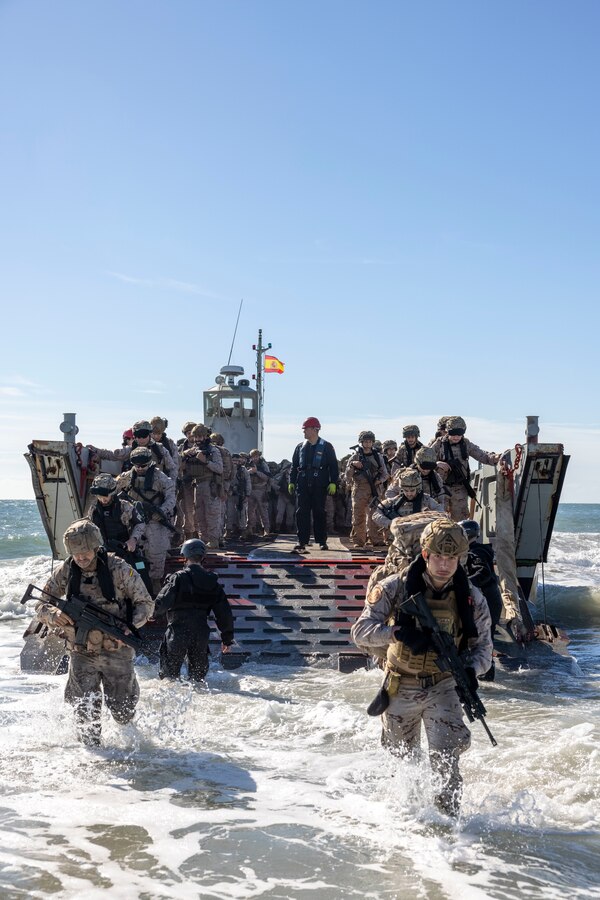Marines with Infantería de Marina, (Spanish marine corps), disembark from landing craft mechanized at Onslow Beach in preparation to execute exercise UNITAS 2025, Marine Corps Base Camp Lejeune, North Carolina, Sep. 12, 2025. UNITAS, which is Latin for “unity,” was conceived in 1959 and has taken place annually since first conducted in 1960. This year marks the 66th iteration of the world’s longest running annual multinational maritime exercise. (U.S. Marine Corps photo by Lance Cpl. Payton Goodrich)