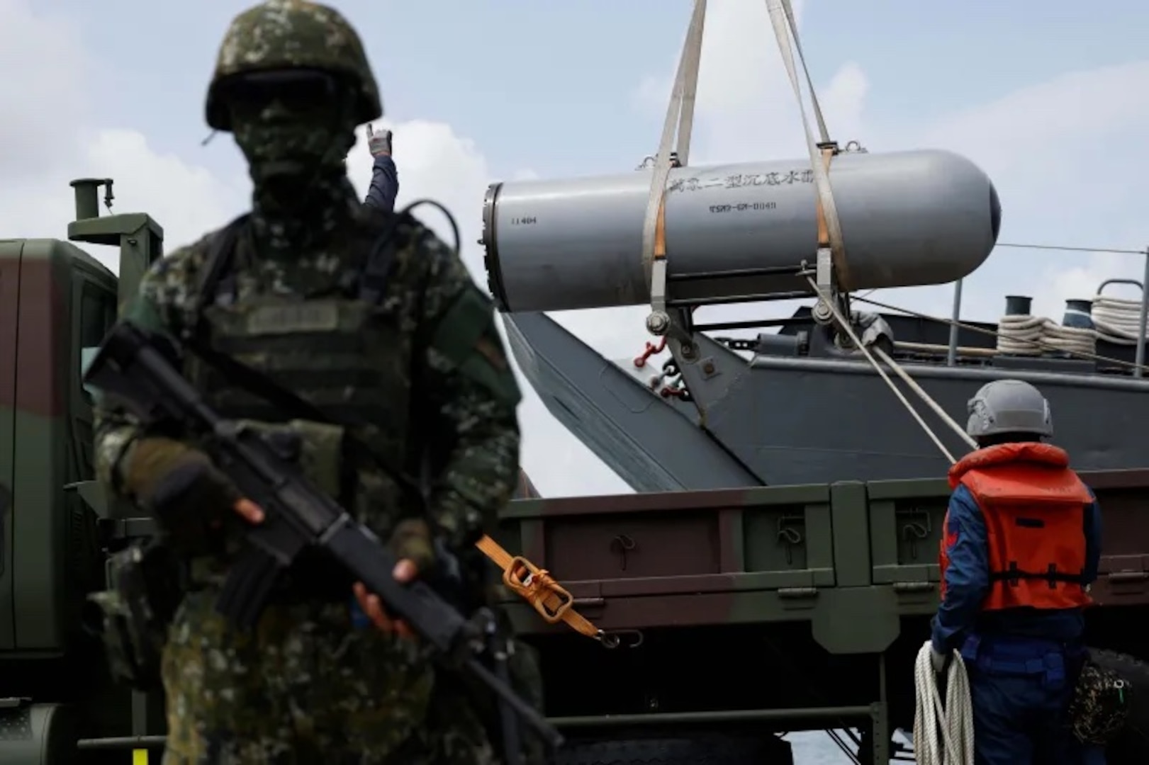Soldiers loading sea mines during a military exercise in Kaohsiung, Taiwan