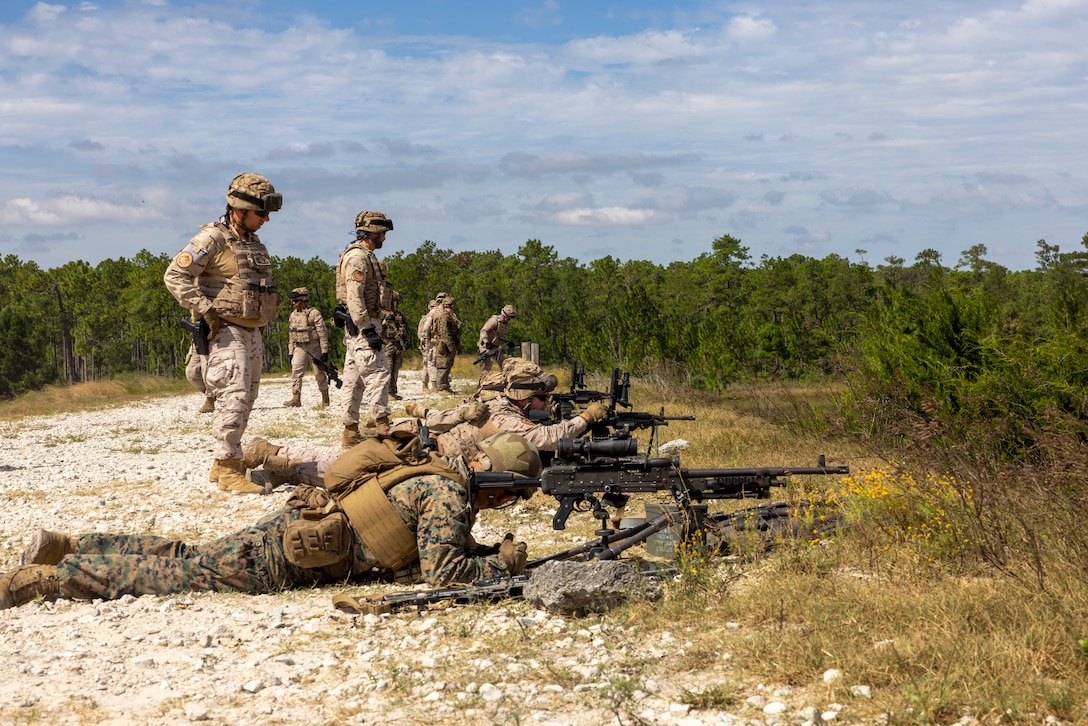 U.S. Marine Corps Sgt. John Aguilar, with 2nd Battalion 2nd Marine Regiment, watches as marines with the Infantería de Marina (Spanish marine corps), marines, fire the M249 squad automatic weapon during a medium machine gun range as part of UNITAS 2025 taking place on Marine Corps Base Camp Lejeune, North Carolina, Sep. 12, 2025. UNITAS, which is Latin for “unity,” was conceived in 1959 and has taken place annually since first conducted in 1960. This year marks the 66th iteration of the world’s longest running annual multinational maritime exercise. (U.S. Marine Corps photo by Lance Cpl. Payton Goodrich)