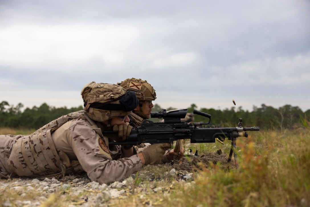 Cabo 1 Luis Alberto Rey Garcia, and Marinero Manuel Gomez Orihuela, with Infantería de Marina (Spanish marine corps) fire a M249 squad automatic weapon during a medium machine gun range as part of UNITAS 2025 taking place on Marine Corps Base Camp Lejeune, North Carolina, Sep. 12, 2025. UNITAS, which is Latin for “unity,” was conceived in 1959 and has taken place annually since first conducted in 1960. This year marks the 66th iteration of the world’s longest running annual multinational maritime exercise. (U.S. Marine Corps photo by Lance Cpl. Payton Goodrich)