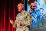 Gen. Andrew P. Poppas, U.S. Army Forces Command, commanding general, delivers a presentation on operationalizing warfighting readiness during the first day of the annual Maneuver Warfighter Conference, Sept. 9, 2025, in Marshall Auditorium at Fort Benning, Georgia. The annual Maneuver Warfighter Conference gathers U.S. Army senior leaders and subject-matter experts from across the globe to discuss the way forward for maneuver forces. (U.S. Army photo by Joey Rhodes II)